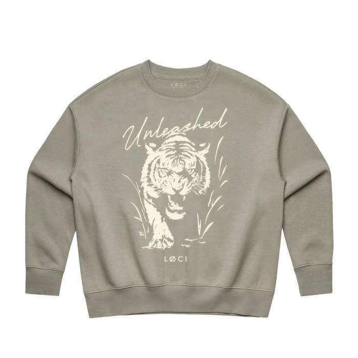 Sage green sweatshirt with a white tiger graphic and 'Unleashed' text on a white background