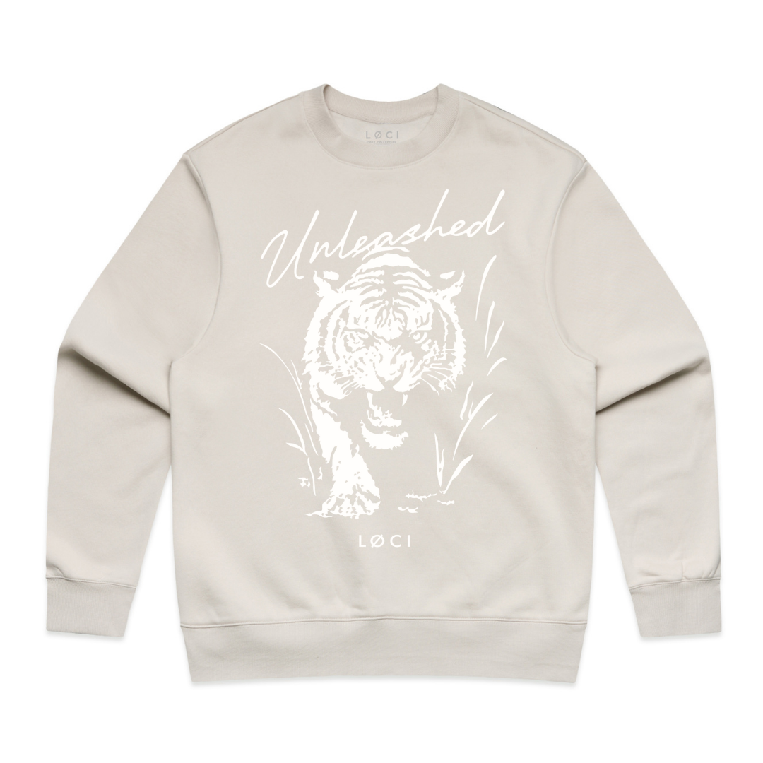 Beige sweatshirt with a white tiger graphic and 'Unleashed' text on a white background