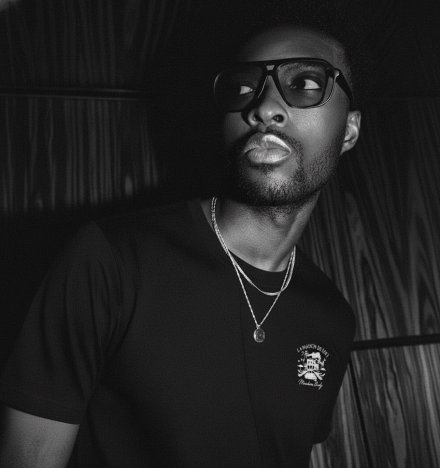 Male model wearing a black LØCI graphic T-shirt